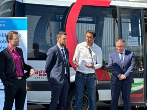 Stakeholders including Kuba's Tarik Dinane gather to celebrate the launch of a new transit ticketing system in Gueret